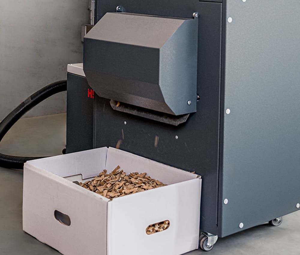 Sortie d&eacute;di&eacute;e des copeaux cartons du matelasseur de cartons pour calage HSM ecoChip standard Profipack monophasé